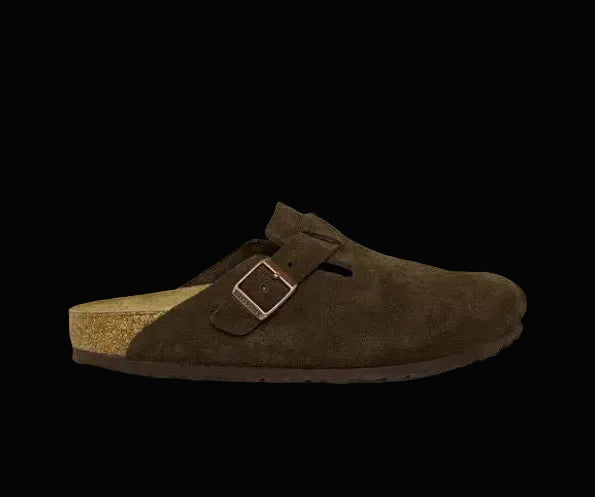 Brown suede sandal with a buckle on a white background
